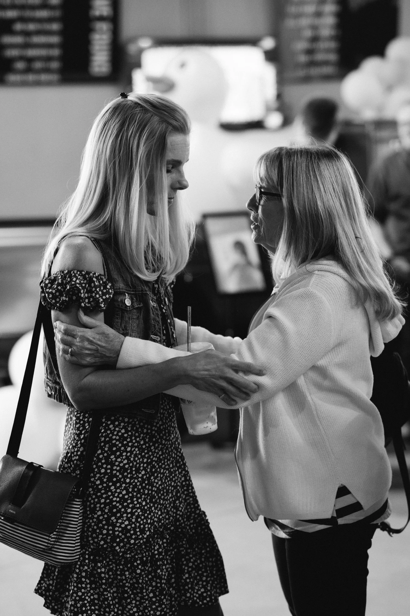 two women praying with each other
