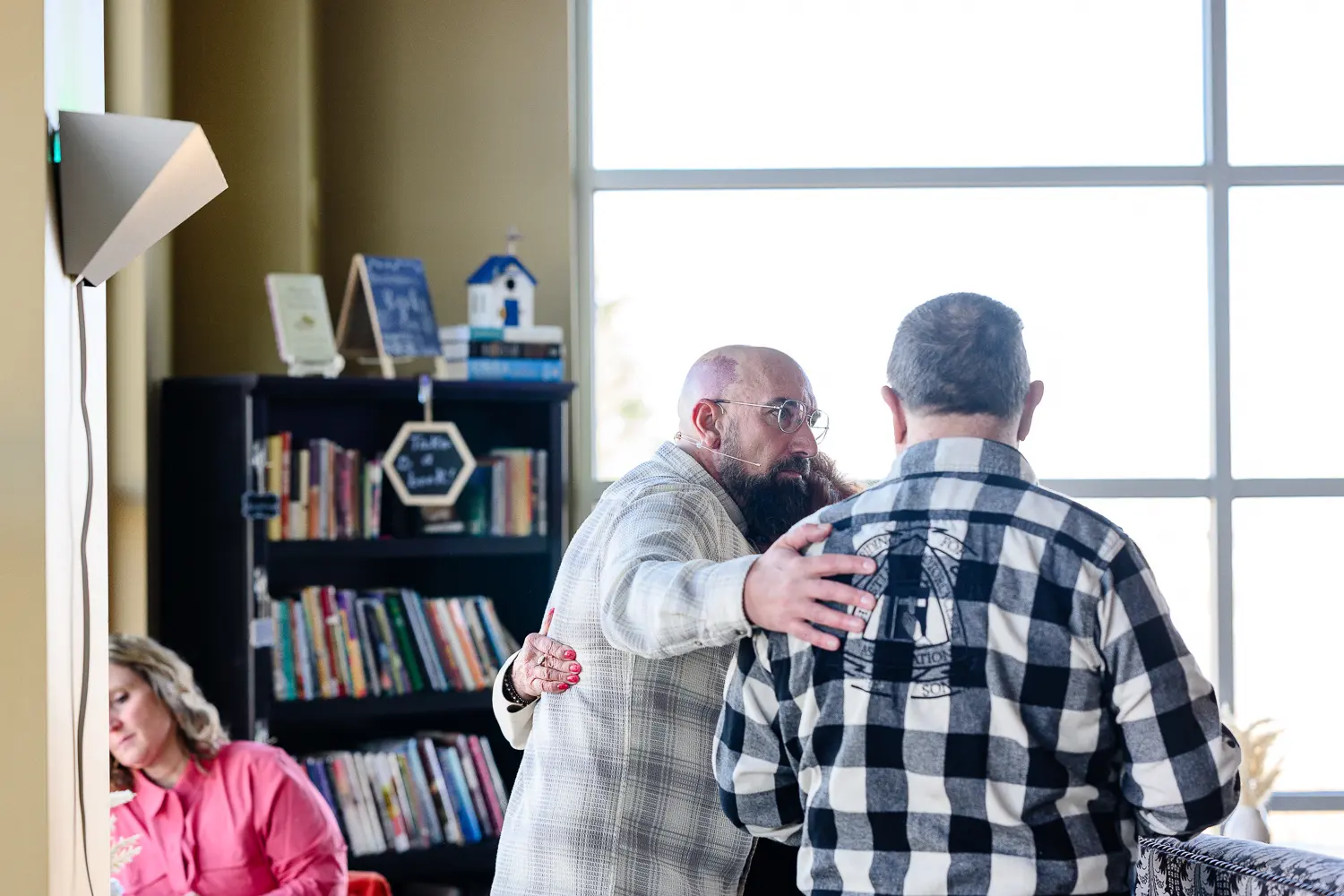 a pastor greeting people