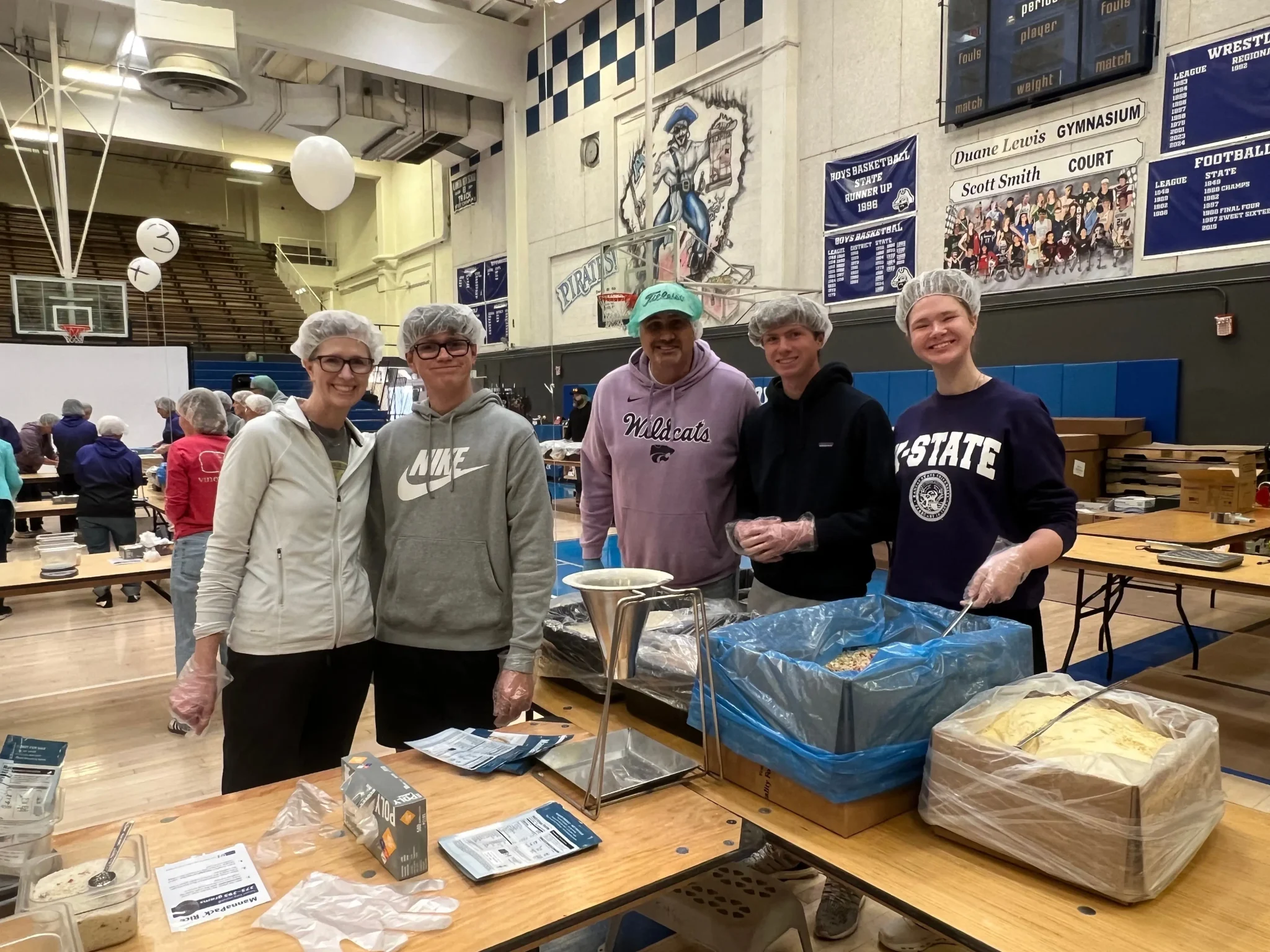 a group filling bags with food